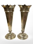 A pair of loaded silver trumpet vases, Sheffield marks, height 16cm.