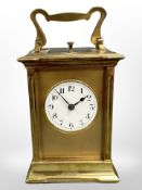 A French brass-cased repeating carriage clock, white Arabic dial and platform escapement,