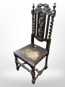 A 19th century carved and ebonised oak hall chair
