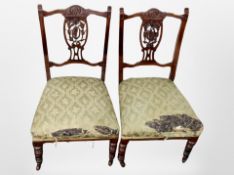 A pair of Victorian carved walnut salon chairs,