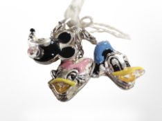 Three enameled silver Disney-themed charms including Mickey Mouse and Donald Duck.