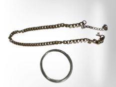 A gold-plated chain and a steel bangle.