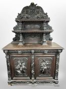 A 19th century heavily carved oak sideboard,