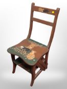 A painted metamorphic library chair decorated with cats