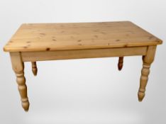 A contemporary pine farmhouse dining table, length 150 cm,