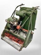 An Atco petrol garden mower/roller