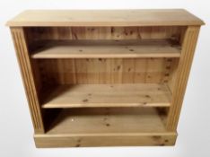 A contemporary pine open bookcase,