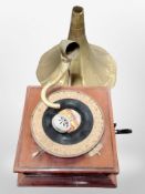 A His Master's Voice gramophone with brass horn.