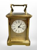 A brass-cased carriage clock signed Richard & Cie, thirteen jewel movement with platform escapement,