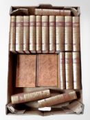 A box of Charles Dickens volumes,