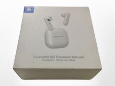 A boxed pair of Timekettle M2 translator ear buds.