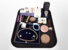 A tray containing cosmetics, costume jewellery, gents wristwatches including Lorus.