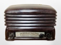 A mid-20th century Bakelite-cased valve radio, width 31cm.