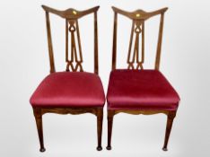 A pair of Edwardian oak Arts & Crafts salon chairs