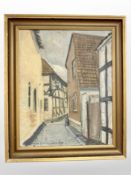 C Skousjaard : A cobbled lane through a town, oil on canvas, 32cm x 39cm.