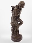 A bronze figure of a semi-nude maiden seated on a rock on turned marble plinth, height 29.5cm.