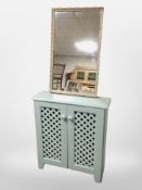A gilt framed rectangular mirror and painted double door low cabinet,