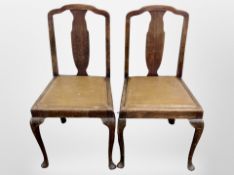 A pair of Queen Anne style oak dining chairs