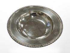 A silver dish, London marks, diameter 15cm.