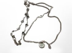 A silver swirl pendant on flat link chain, a silver star bracelet inset with white stones.