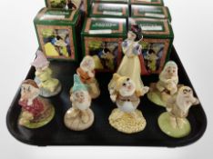 Eight Royal Doulton Walt Disney classic figures, Snow White and the Seven Dwarves, boxed.