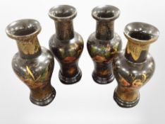 Four 20th century oriental lacquered baluster vases, height 39cm.
