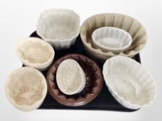 A collection of 19th century and later earthenware and glass jelly moulds (2 trays).