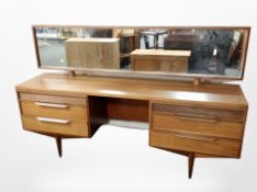 A White & Newton teak kneehole mirror back dressing table, fitted four drawers,