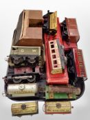 A collection of tin plate rolling stock and painted wooden railway models including Hornby.