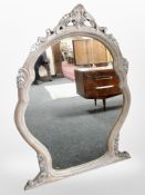 A contemporary French style over mantel mirror,