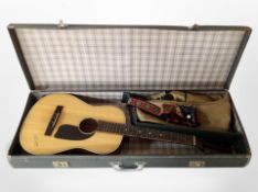 A 20th century German classical guitar in hard carry case.