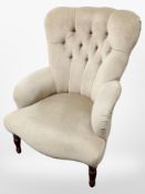 A Victorian style buttoned lady's armchair