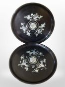 A pair of early 20th century Japanese lacquer trays inlaid with mother of pearl, diameter 34cm.