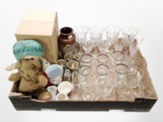 A box of crystal champagne flutes and other drinking glasses, set of plated egg cups on stand,