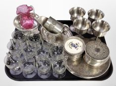 A quantity of silver-plated place mats and coasters, set of four stainless steel goblets,