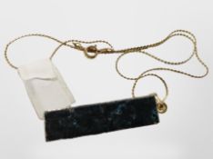 A fool's gold iron pyrite crystal pendant on gold-plated chain.