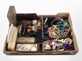 A box of assorted collectables, including costume bead necklaces, writing utensils, pocket knife,