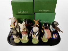 Eight John Beswick Pig Promenade figures, boxed.