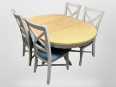 A contemporary painted oval extending dining table, 154 cm x 113 cm x 75 cm,
