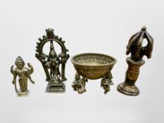 A group of four 19th century Tibetan brass devotional temple figures,