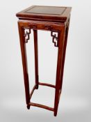 A Chinese carved hardwood plant stand, 92cm high, 30cm wide.