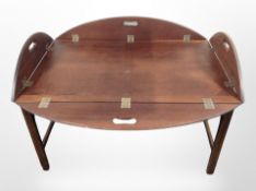 A mahogany butler's tray table on stand, 92cm x 61cm x 63cm (unfolded).