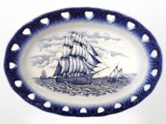 A blue and white meat plate depicting ships at sea, width 46cm.