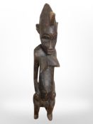 An African carved fertility figure, height 54cm.
