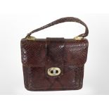 A vintage lady's snakeskin handbag, width 25cm.