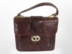 A vintage lady's snakeskin handbag, width 25cm.
