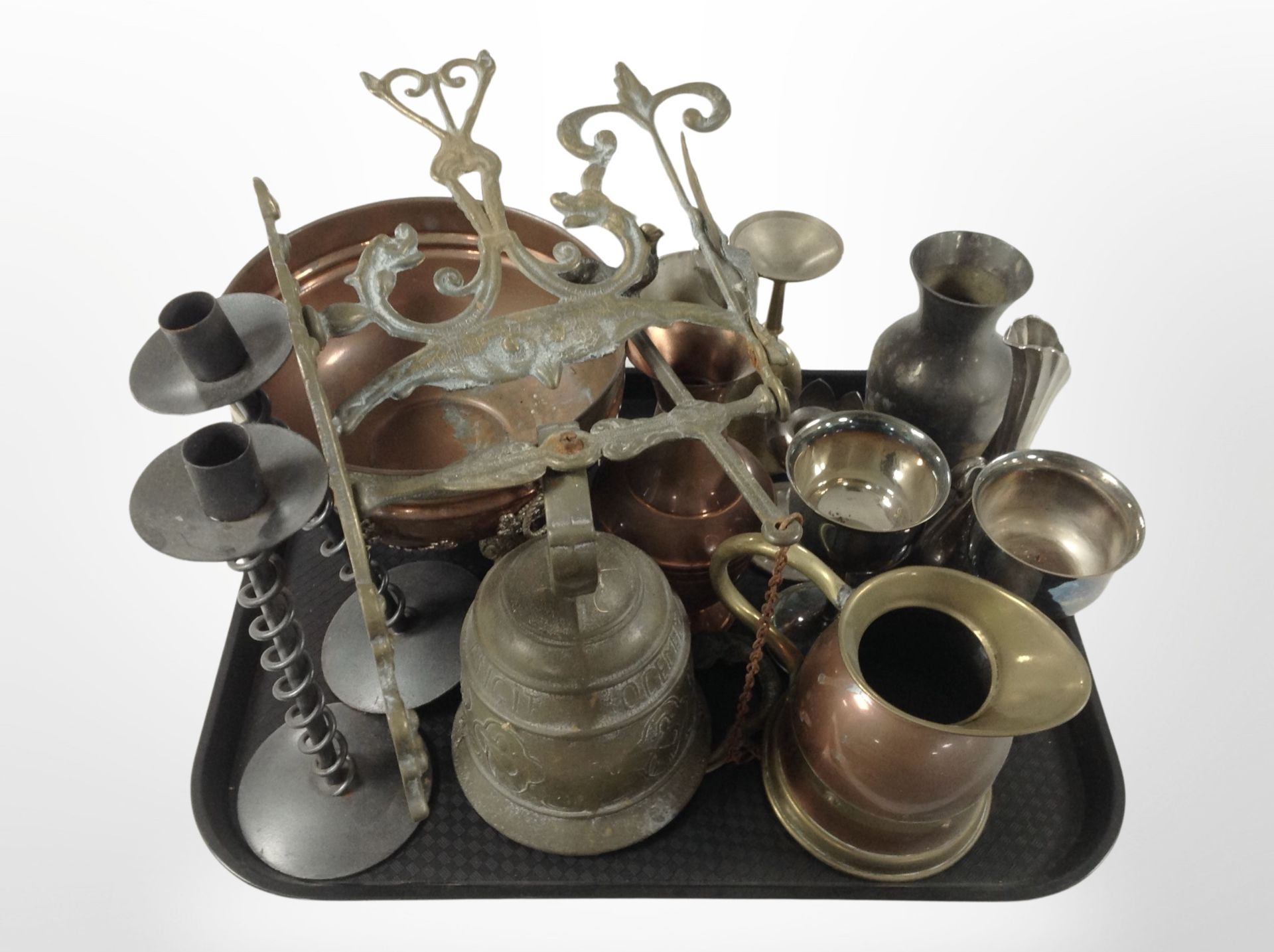 A group of metal wares including copper twin-handled bowl, a pair of wrought-metal candlesticks,