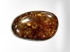 A Baltic amber and white metal brooch, 20g, length 57 mm.