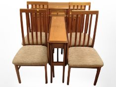 A late 20th-century teak six-piece dining room suite comprising of drop-leaf dining table,