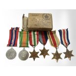 A group of WWII medals in box of issue named to J D Cox,